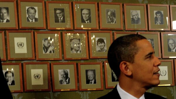 President Barack Obama sits in front of framed photos of previous Nobel Peace Prize winners during a Signing Ceremony at the Norwegian Nobel Institute in Oslo, Norway, Thursday, Dec. 10, 2009. - Sputnik International