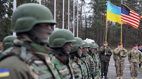 US and Ukrainian soldiers attend an opening ceremony of the joint Ukrainian-US military exercise Fearless Guardian at the Yavoriv training ground. - Sputnik International