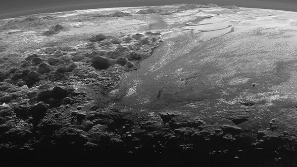 A close-up view of the rugged, icy mountains and flat ice plains on Pluto is seen in an image from NASA's New Horizons spacecraft - Sputnik International