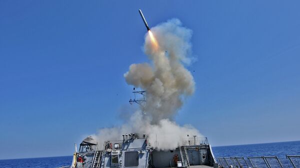 The guided missile destroyer USS Barry (DDG 52) launches a Tomahawk cruise missile - Sputnik International