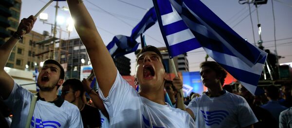 Supporters of conservative New Democracy party shout slogans before the pre-election speech by party's leader Evangelos Meimarakis at Omonia square in Athens, Sept. 17, 2015. Supporters of conservative New Democracy party shout slogans before the pre-election speech by party's leader Evangelos Meimarakis at Omonia square in Athens, Sept. 17, 2015. - Sputnik International