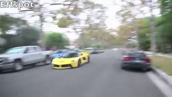 Screenshot from a cell phone video showing a yellow Ferrari belonging to Sheikh Khalid Hamad Al-Thani engaged in a street race in suburban Los Angeles. - Sputnik International