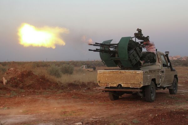 Rebel fighters fire a heavy machine gun during clashes with Syrian pro-government forces on the frontline facing Deir al-Zoghb, a government-held area in the northwestern Idlib province, on August 31, 2015 Rebel fighters fire a heavy machine gun during clashes with Syrian pro-government forces on the frontline facing Deir al-Zoghb, a government-held area in the northwestern Idlib province, on August 31, 2015 - Sputnik International