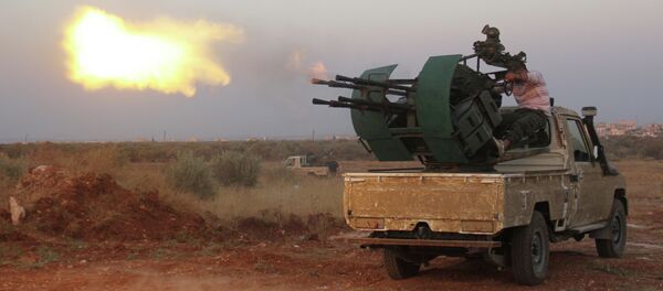 Rebel fighters fire a heavy machine gun during clashes with Syrian pro-government forces on the frontline facing Deir al-Zoghb, a government-held area in the northwestern Idlib province, on August 31, 2015 Rebel fighters fire a heavy machine gun during clashes with Syrian pro-government forces on the frontline facing Deir al-Zoghb, a government-held area in the northwestern Idlib province, on August 31, 2015 - Sputnik International