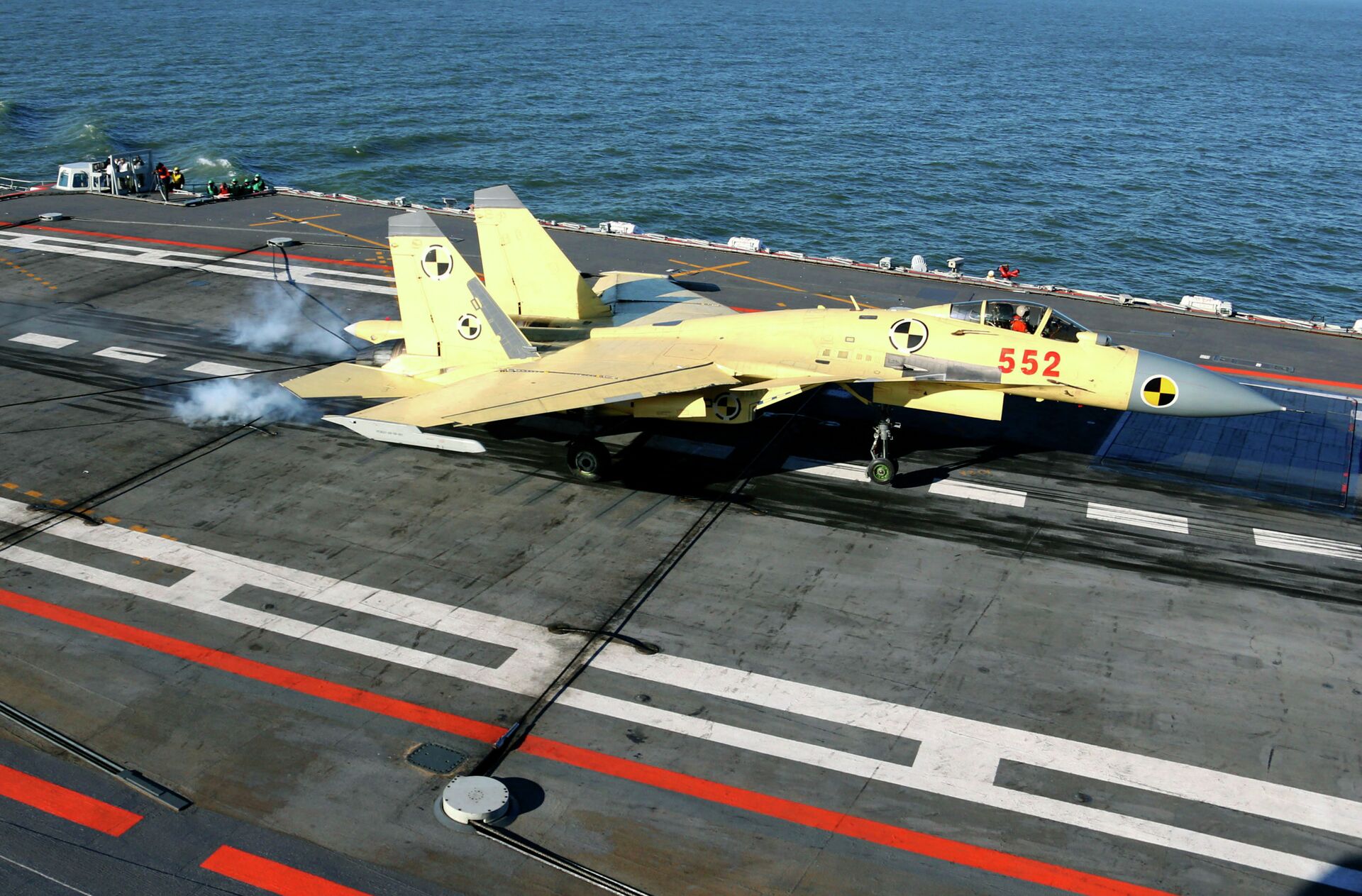 In this undated photo released by China's Xinhua News Agency, a carrier-borne J-15 fighter jet lands on China's first aircraft carrier, the Liaoning - Sputnik International, 1920, 19.12.2022