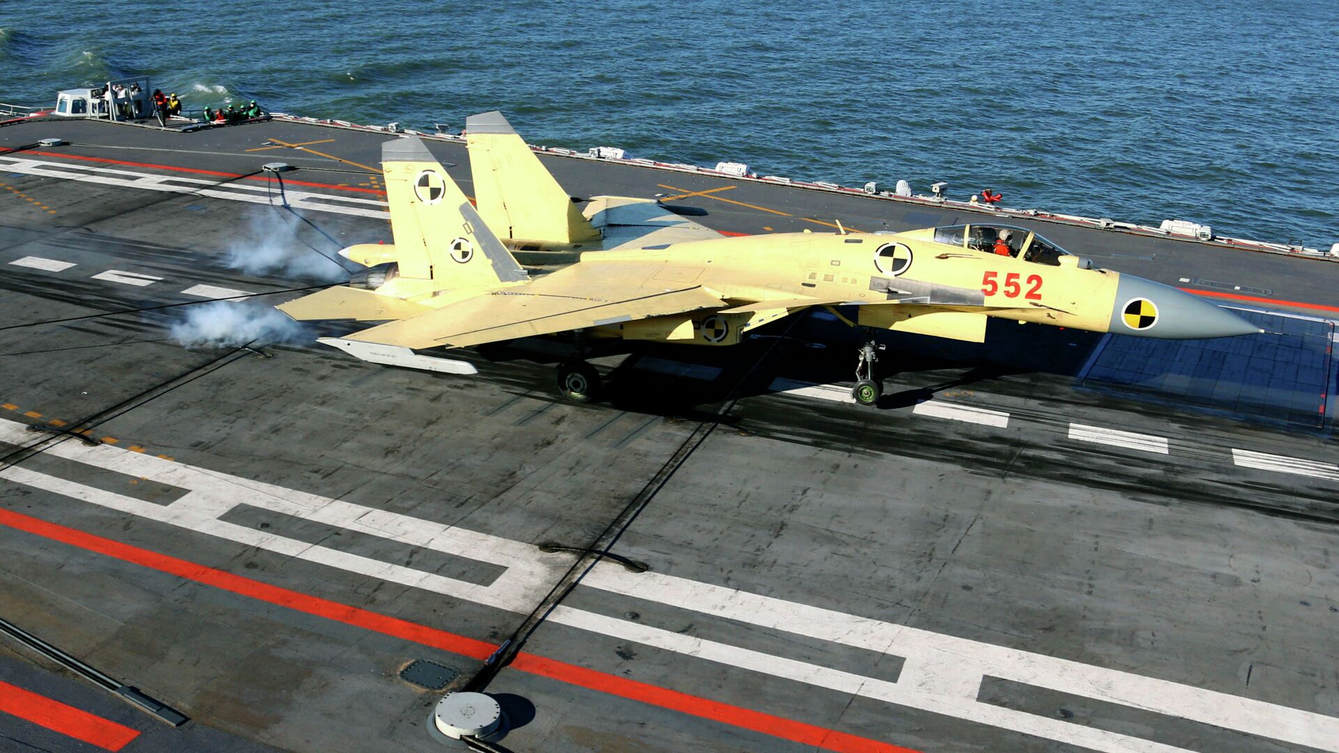 In this undated photo released by China's Xinhua News Agency, a carrier-borne J-15 fighter jet lands on China's first aircraft carrier, the Liaoning - Sputnik International, 1920, 04.05.2021