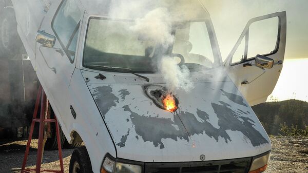 Lockheed Martin ATHENA laser weapon system defeats a truck target by disabling the engine, demonstrating its military effectiveness against enemy ground vehicles Lockheed Martin ATHENA laser weapon system defeats a truck target by disabling the engine, demonstrating its military effectiveness against enemy ground vehicles - Sputnik International