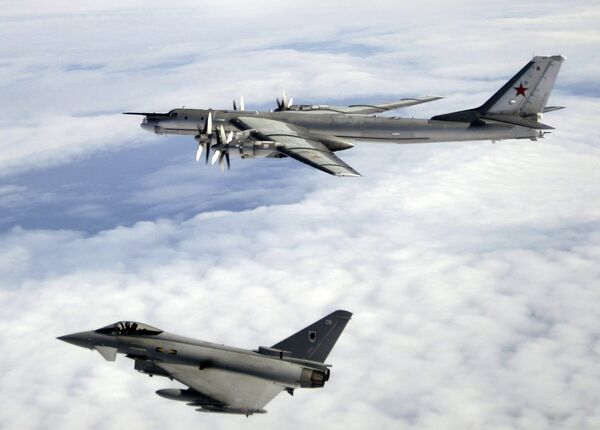 A Tu-95 being escorted by an RAF Typhoon. File photo  - Sputnik International