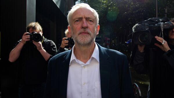 Newly elected leader of Britain's opposition Labour party Jeremy Corbyn leaves the Party's headquarters in London on September 14, 2015 - Sputnik International