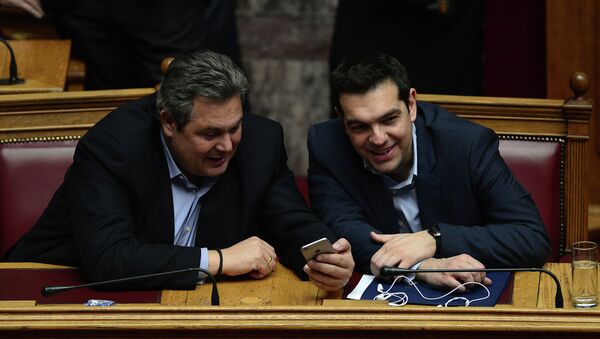 Greece's prime minister Alexis Tsipras (R) chats with member of coalition government and defense minister Panos Kammenos the confidence vote early on February 11, 2015. - Sputnik International