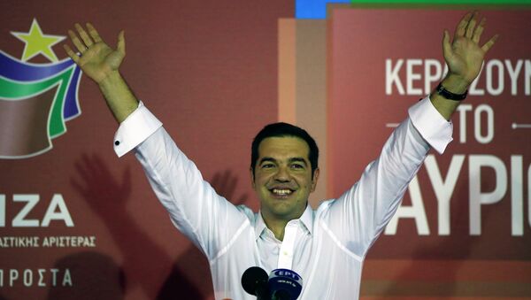 Alexis Tsipras the leader of left-wing Syriza party waves to his supporters after the election results at the party’s main electoral center in Athens, Sunday, Sept. 20, 2015. - Sputnik International