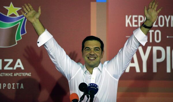 Alexis Tsipras the leader of left-wing Syriza party waves to his supporters after the election results at the party’s main electoral center in Athens, Sunday, Sept. 20, 2015.  - Sputnik International