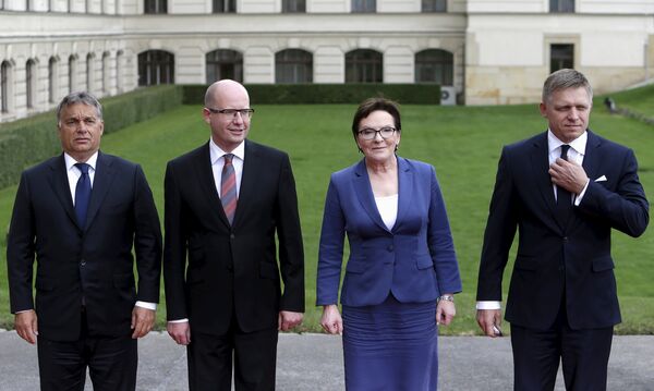 Prime Ministers of the Visegrad Group (V4), Hungary's Prime Minister Viktor Orban (L-R), Czech Republic's Prime Minister Bohuslav Sobotka, Poland's Prime Minister Ewa Kopacz and Slovakia's Prime Minister Robert Fico pose for a group photo during an extraordinary Visegrad Group summit aimed at resolving the migration crisis in Prague, Czech Republic, September 4, 2015. Prime Ministers of the Visegrad Group (V4), Hungary's Prime Minister Viktor Orban (L-R), Czech Republic's Prime Minister Bohuslav Sobotka, Poland's Prime Minister Ewa Kopacz and Slovakia's Prime Minister Robert Fico pose for a group photo during an extraordinary Visegrad Group summit aimed at resolving the migration crisis in Prague, Czech Republic, September 4, 2015. - Sputnik International