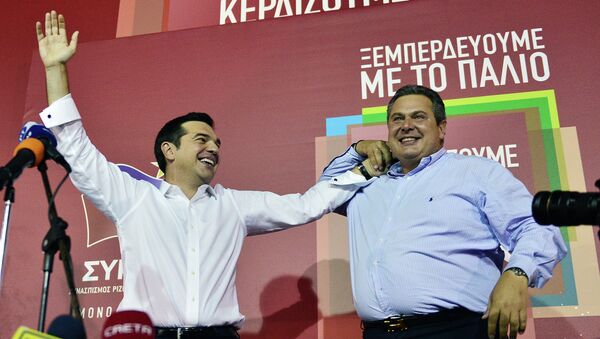 Syriza leader Alexis Tsipras (L) celebrates with Independent Greeks (ANEL) party leader Panos Kamenos after his party's victory in the Greek general elections at his campaign headquarters in Athens on September 20, 2015 - Sputnik International
