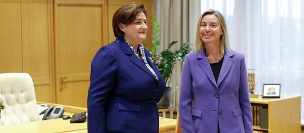 European Union High Representative Federica Mogherini, right, and Lithuania's Speaker of the Parliament Loreta Grauziniene pose for photographers during a meeting at the Parliament's palace in Vilnius, Lithuania, Monday, Sept. 21, 2015 European Union High Representative Federica Mogherini, right, and Lithuania's Speaker of the Parliament Loreta Grauziniene pose for photographers during a meeting at the Parliament's palace in Vilnius, Lithuania, Monday, Sept. 21, 2015 - Sputnik International