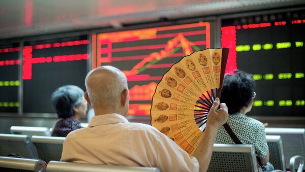 Investors look at screens showing stock market movements at a securities company in Beijing on July 28, 2015 - Sputnik International