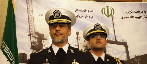 Rear Admiral Habibollah Sayyari (L), commander of the Iranian navy, stands under portraits of Iranian supreme leader Ayatollah Ali Khamenei and late revolutionary founder Ayatollah Khomeini (L) during a press conference at the Iranian embassy in the Syrian capital Damascus on February 28, 2011 Rear Admiral Habibollah Sayyari (L), commander of the Iranian navy, stands under portraits of Iranian supreme leader Ayatollah Ali Khamenei and late revolutionary founder Ayatollah Khomeini (L) during a press conference at the Iranian embassy in the Syrian capital Damascus on February 28, 2011 - Sputnik International