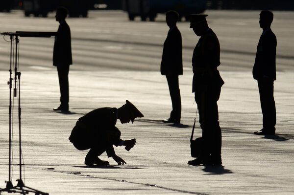 Chinese soldier marks a spot on the ground before a military parade at Tiananmen Square in Beijing on September 3, 2015, to mark the 70th anniversary of victory over Japan and the end of World War II Chinese soldier marks a spot on the ground before a military parade at Tiananmen Square in Beijing on September 3, 2015, to mark the 70th anniversary of victory over Japan and the end of World War II - Sputnik International