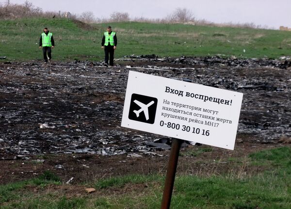 A sign on the crash site of the Malaysia Airlines flight MH17 Boeing en route from Amsterdam to Kuala Lumpur A sign on the crash site of the Malaysia Airlines flight MH17 Boeing en route from Amsterdam to Kuala Lumpur - Sputnik International