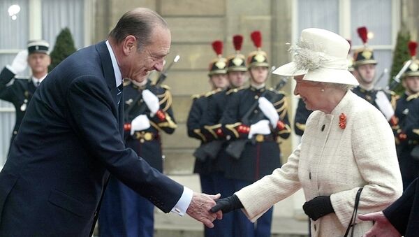 Queen Elizabeth II and French President Jacques Chirac shake hands as Republican Guards salute the queen's arrival at the Elysee Palace in Paris Monday, April 5, 2004, as she started a three-day state visit to France to mark 100 years of formal friendship between France and Britain.  - Sputnik International