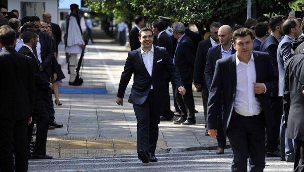 Greece's Prime Minister Alexis Tsipras leaves the presidential palace after his cabinet's swearing in ceremony in Athens, Wednesday, Sept. 23, 2015 - Sputnik International