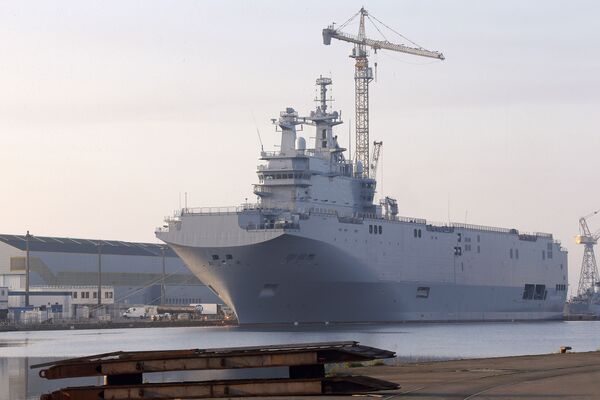 In this Friday, Sept. 5, 2014 file photo, the Vladivostok warship, the first of two Mistral-class helicopter carriers ordered by Russia, docks on the port of Saint-Nazaire, western France. Both ships have since been sold to Egypt. In this Friday, Sept. 5, 2014 file photo, the Vladivostok warship, the first of two Mistral-class helicopter carriers ordered by Russia, docks on the port of Saint-Nazaire, western France. Both ships have since been sold to Egypt. - Sputnik International