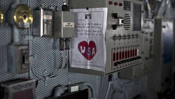 In this Thursday, Sept. 10, 2015 photo, a letter of support to members of the US military received in a care package is hanged inside the Pilot Bridge on board the USS Theodore Roosevelt currently deployed in the Persian Gulf. - Sputnik International