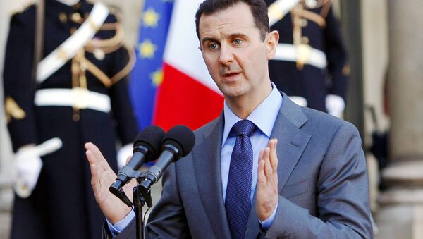 In this Thursday Dec. 9, 2010 file photo, Syria President Bashar al-Assad addresses reporters following his meeting with French President Nicolas Sarkozy at the Elysee Palace in Paris, France. - Sputnik International