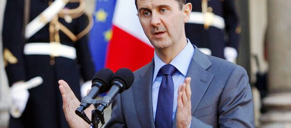 In this Thursday Dec. 9, 2010 file photo, Syria President Bashar al-Assad addresses reporters following his meeting with French President Nicolas Sarkozy at the Elysee Palace in Paris, France. In this Thursday Dec. 9, 2010 file photo, Syria President Bashar al-Assad addresses reporters following his meeting with French President Nicolas Sarkozy at the Elysee Palace in Paris, France. - Sputnik International