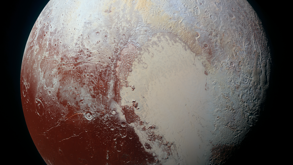 This image combines blue, red and infrared images taken by the Ralph/Multispectral Visual Imaging Camera (MVIC). Pluto’s surface sports a remarkable range of subtle colors, enhanced in this view to a rainbow of pale blues, yellows, oranges, and deep reds. - Sputnik International