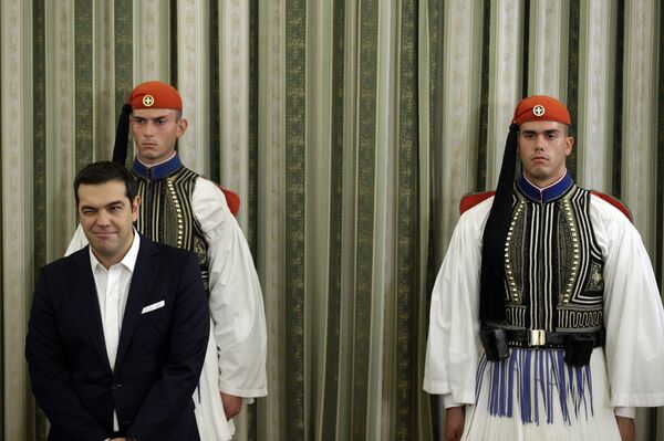 Greece's Prime Minister Alexis Tsipras winks during his cabinet's swearing in ceremony at the presidential palace in Athens, Wednesday, Sept. 23, 2015 - Sputnik International
