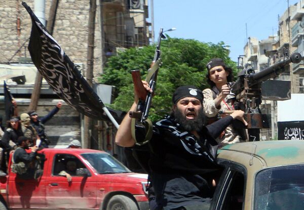 Fighters from Al-Qaeda's Syrian affiliate Al-Nusra Front drive in the northern Syrian city of Aleppo. Fighters from Al-Qaeda's Syrian affiliate Al-Nusra Front drive in the northern Syrian city of Aleppo. - Sputnik International