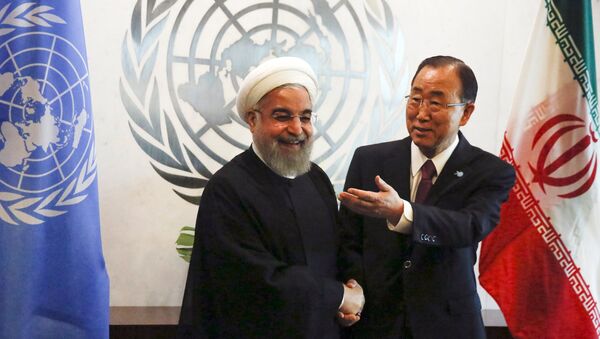 UN Secretary-General Ban Ki-moon (R) gestures as he poses for a photograph with Iran's President Hassan Rouhani during their meeting ahead of the United Nations General Assembly at the United Nations Headquarters in New York, September 26, 2015. - Sputnik International