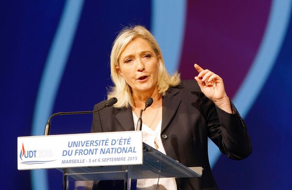 President of France's far right National Front party Marine Le Pen, delivers her speech during their summer meeting, in Marseille, southern France, Saturday, Sep. 6, 2015 President of France's far right National Front party Marine Le Pen, delivers her speech during their summer meeting, in Marseille, southern France, Saturday, Sep. 6, 2015 - Sputnik International