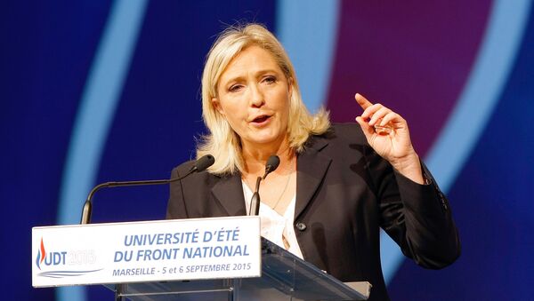 President of France's far right National Front party Marine Le Pen, delivers her speech during their summer meeting, in Marseille, southern France, Saturday, Sep. 6, 2015 - Sputnik International