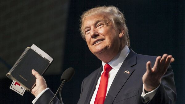US Republican presidential candidate Donald Trump holds his bible while speaking at the Iowa Faith and Freedom Coalition Forum in Des Moines, Iowa, September 19, 2015 - Sputnik International