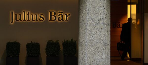 A man enters the Swiss private banking group Julius Baer headquarters on September 24, 2012 in Zurich A man enters the Swiss private banking group Julius Baer headquarters on September 24, 2012 in Zurich - Sputnik International