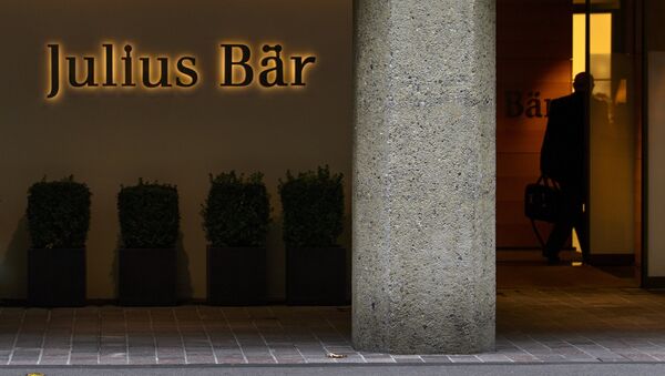 A man enters the Swiss private banking group Julius Baer headquarters on September 24, 2012 in Zurich - Sputnik International
