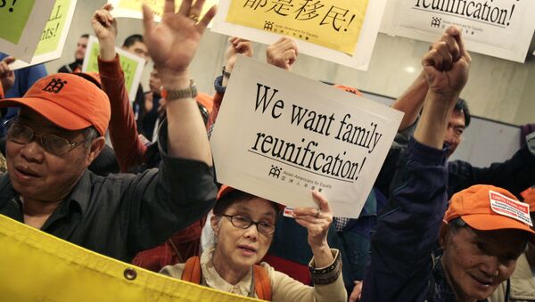 A group of Asian-Americans joins others that support reform of immigration legislation at a rally in New York, Tuesday, May 1, 2007 - Sputnik International