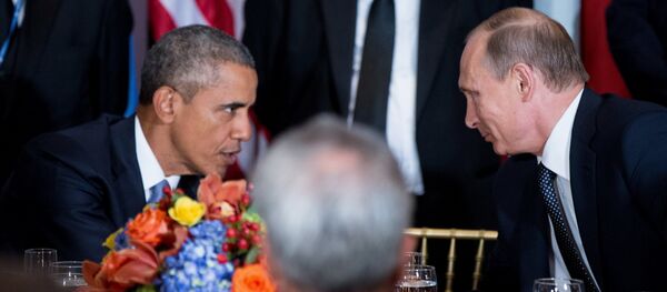 President Barack Obama and Russian President President Vladimir Putin greet each other during a luncheon, Monday, Sept. 28, 2015, at United Nations headquarters. - Sputnik International