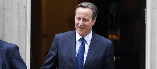 British Prime Minister David Cameron departs his official residence 10 Downing Street, for Prime Minister’s Questions at the House of Commons in London, Wednesday, Sept. 9, 2015. British Prime Minister David Cameron departs his official residence 10 Downing Street, for Prime Minister’s Questions at the House of Commons in London, Wednesday, Sept. 9, 2015. - Sputnik International