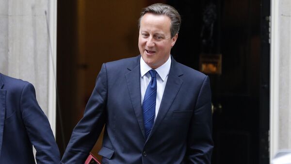 British Prime Minister David Cameron departs his official residence 10 Downing Street, for Prime Minister’s Questions at the House of Commons in London, Wednesday, Sept. 9, 2015. - Sputnik International