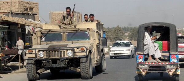 Afghan security forces travel on an armored vehicle in Kunduz Province, Afghanistan September 28, 2015 Afghan security forces travel on an armored vehicle in Kunduz Province, Afghanistan September 28, 2015 - Sputnik International