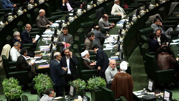 Iranian members of parliament attend a parliamentary session in Tehran on June 23, 2015 - Sputnik International
