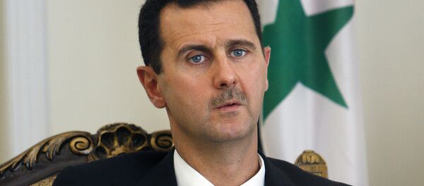 FILE - This Aug. 19, 2009 file photo shows Syrian President Bashar Assad during a meeting with his Iranian counterpart Mahmoud Ahmadinejad in Tehran, Iran - Sputnik International