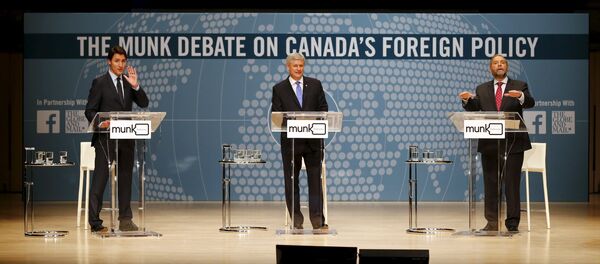 Liberal leader Justin Trudeau (L), Conservative leader and Prime Minister Stephen Harper, and New Democratic Party (NDP) leader Thomas Mulcair (R) take part in the Munk leaders' debate on Canada's foreign policy in Toronto, Canada September 28, 2015 Liberal leader Justin Trudeau (L), Conservative leader and Prime Minister Stephen Harper, and New Democratic Party (NDP) leader Thomas Mulcair (R) take part in the Munk leaders' debate on Canada's foreign policy in Toronto, Canada September 28, 2015 - Sputnik International