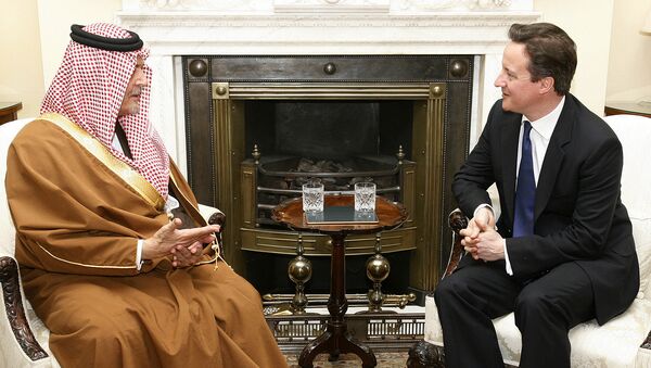 Britain's Prime Minister David Cameron, right, meets with Saudi Arabia's Foreign Minister Prince Saud Al Faisal. - Sputnik International