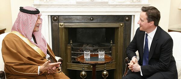Britain's Prime Minister David Cameron, right, meets with Saudi Arabia's Foreign Minister Prince Saud Al Faisal. - Sputnik International