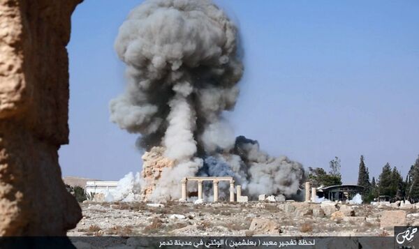 This undated photo released Tuesday, Aug. 25, 2015, file photo, on a social media site used by Islamic State militants, which has been verified and is consistent with other AP reporting, shows smoke from the detonation of the 2,000-year-old temple of Baalshamin in Syria's ancient caravan city of Palmyra This undated photo released Tuesday, Aug. 25, 2015, file photo, on a social media site used by Islamic State militants, which has been verified and is consistent with other AP reporting, shows smoke from the detonation of the 2,000-year-old temple of Baalshamin in Syria's ancient caravan city of Palmyra - Sputnik International