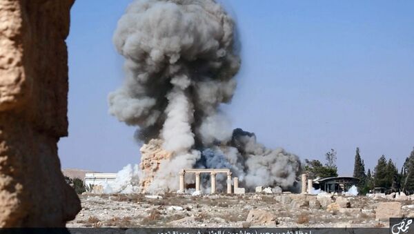 This undated photo released Tuesday, Aug. 25, 2015, file photo, on a social media site used by Islamic State militants, which has been verified and is consistent with other AP reporting, shows smoke from the detonation of the 2,000-year-old temple of Baalshamin in Syria's ancient caravan city of Palmyra - Sputnik International